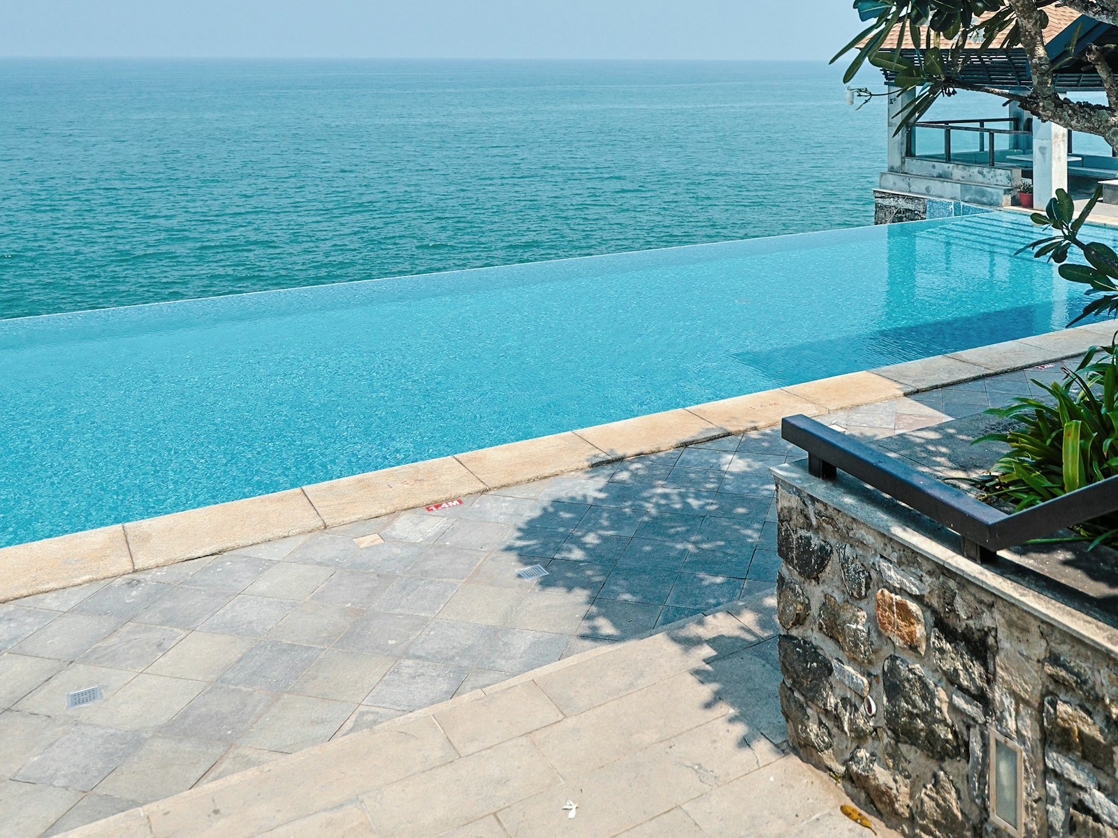 A private infinity pool overlooking the ocean at dusk