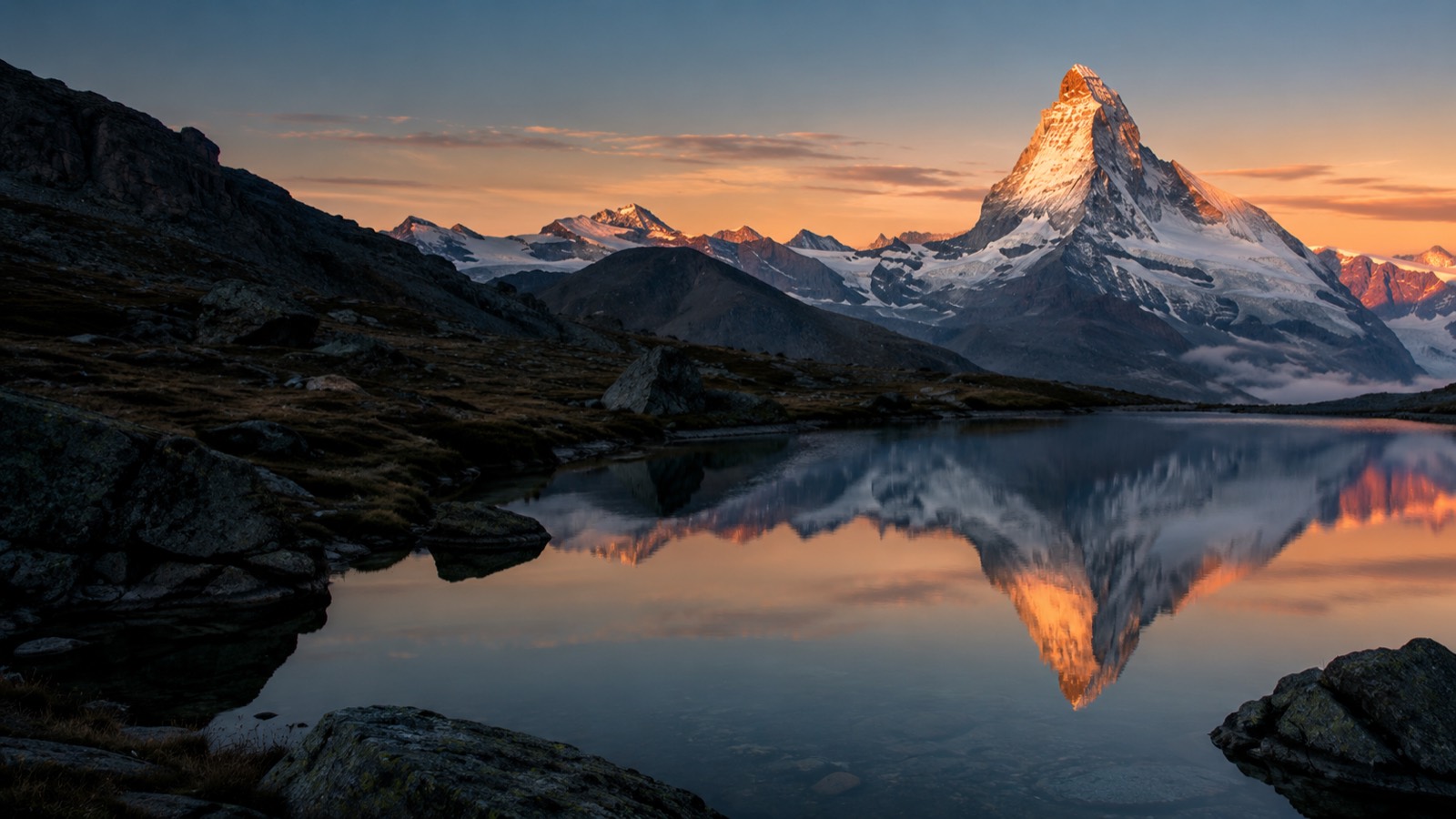 The Matterhorn at sunrise reflected in an alpine lake