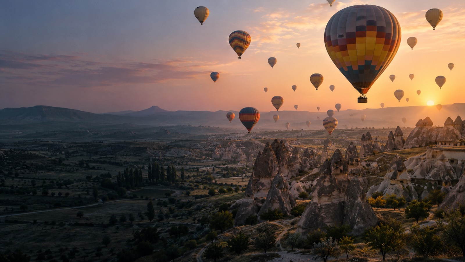 Hot air balloons over Cappadocia at sunrise